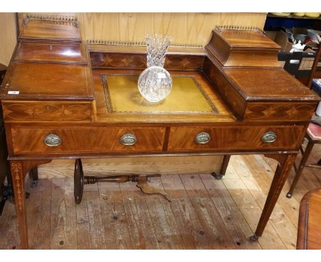 A Late 19th Century Carlton House Mahogany Desk of Typical form; with marquetry and line inlaid decoration, brass galleried u
