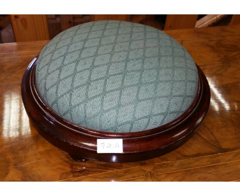 A Circular Upholstered Foot Stool.