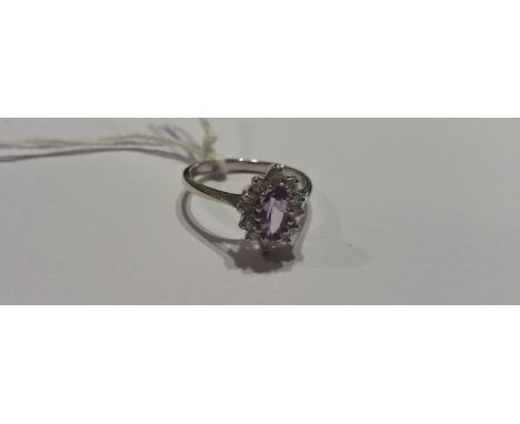 A White Gold Diamond and Amethyst Ring.