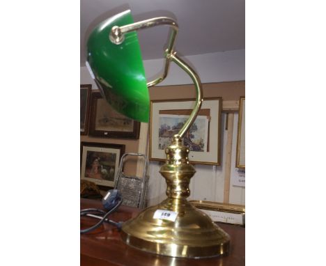 A Brass Bankers Lamp with a Green Shade.