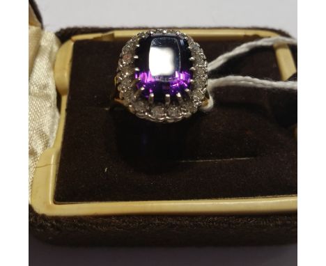 An 18ct Diamond and Amethyst Cluster Ring, amethyst approx 4 carat and diamonds approx 1 carat.