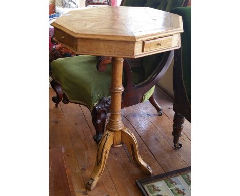 A 19th Century Oak Specimen Occasional Table, the octagonal segmental inlaid top with moulded edge on a carved tripod base wi