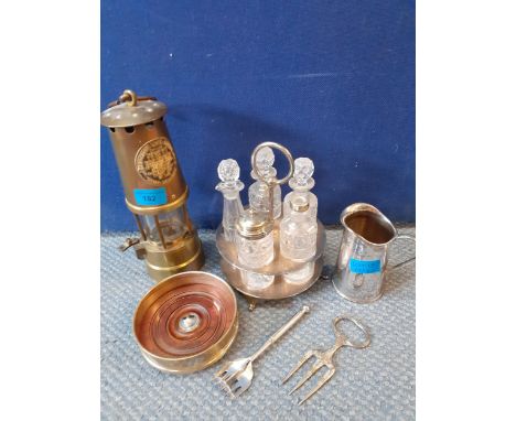 A mixed lot comprising Protector Lamp Lighting Company miners lamp, a silver plated and cut glass condiment set and other sil