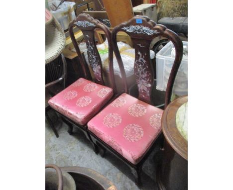 A pair of 20th century Chinese mother of pearl and lacquered hall chairs with vase shaped back and panelled seat on cabriole 