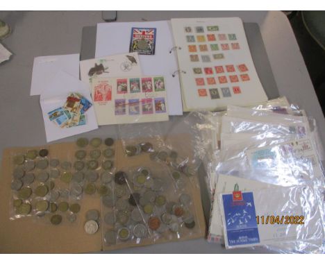 A collection of stamps, First Day covers, loose stamps and coins to include an album of mounted stamps for Austria to Switzer