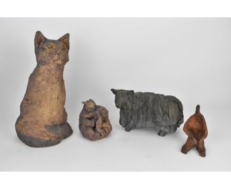 A small collection of ceramic sculptures to include a large model of a seated cat by Mary Orrom, signed 'MO' to underside, a 