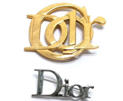 Parfums Christian Dior gold tone logo brooch (6cm) t/w silver tone brooch