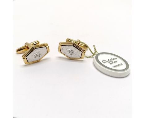 Christian Dior boxed pair of gold / silver tone cufflinks with original swing tag