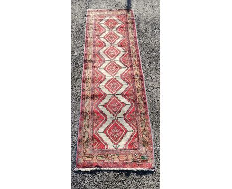 Red grounded runner with diamond detail- 287cm x 81cm