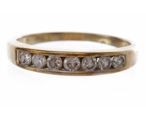DIAMOND HALF ETERNITY RINGwith channel set round brilliant cut diamonds, marked 375, size Q-R, 2.8g