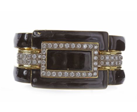 DIAMOND AND ENAMEL BANGLE34mm at widest point, with sections of black enamel and grain set round brilliant cut diamonds, the 