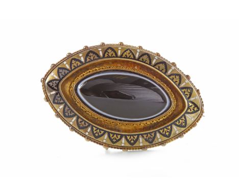 VICTORIAN AGATE AND ENAMEL BROOCHc.1860, of elliptical form and 51mm long, set with a central raised elliptical section of da