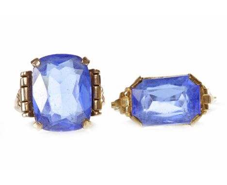 TWO ART DECO PASTE DRESS RINGSeach set with a large blue paste, one marked 10K, size J-K, 5.5g, the other unmarked, size M-N