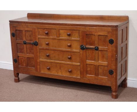 'Mouseman' oak sideboard fitted with two short and three long drawers, flanked by cupboards enclosed by figured panelled door