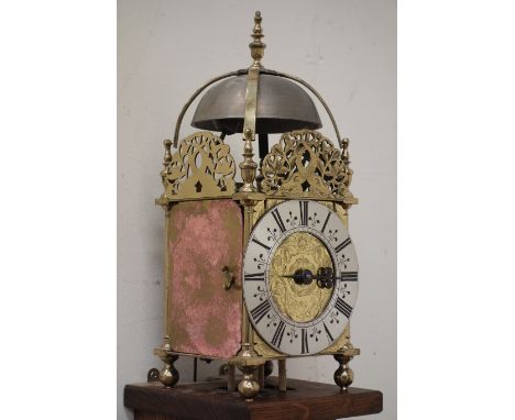 Late 17th century brass lantern clock, dial signed Will. Raynes in Yorke, sea serpent pierced fret work and bell over silvere