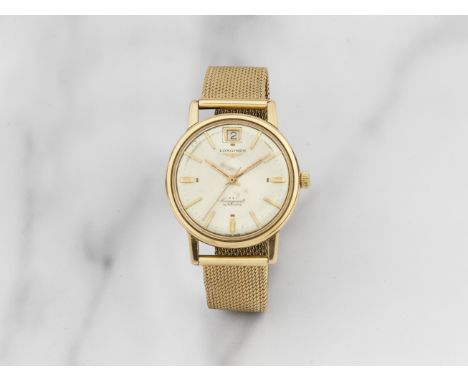 Longines. Montre bracelet en or jaune 18K (750) avec date mouvement automatiqueLongines. An 18K gold automatic calendar brace