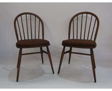 A pair of elm Ercol stickback dining chairs