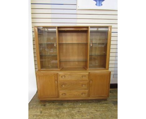 Ercol dresser with glazed doors flanking central glass shelves, base of two cupboard doors and 3 drawers on plinth base (155c