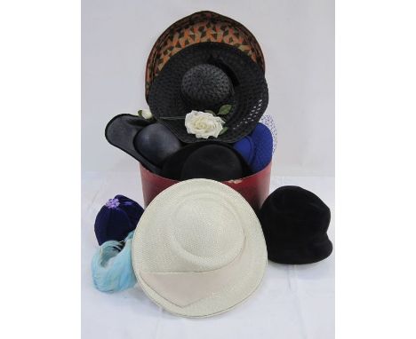 Assorted vintage hats and wedding fascinators of various colours, including feather head decoration, felt bowler-style hats, 