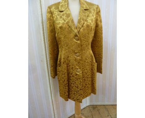 Chris Clyne CollectionGold silk brocade evening three quarter length jacket, three button fastening, with the sleeves embelli