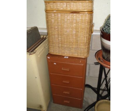 A 4 drawer chest containing tool compartments and some tools and a wicker basket