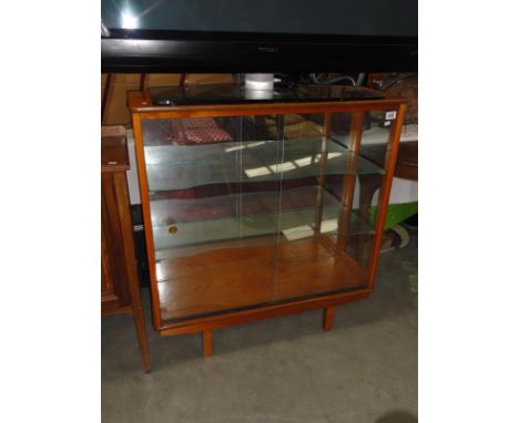 A 3 shelf glazed cabinet