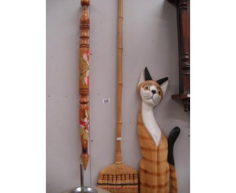 A cat figure, large tourist ware pencil and vintage floor sweep