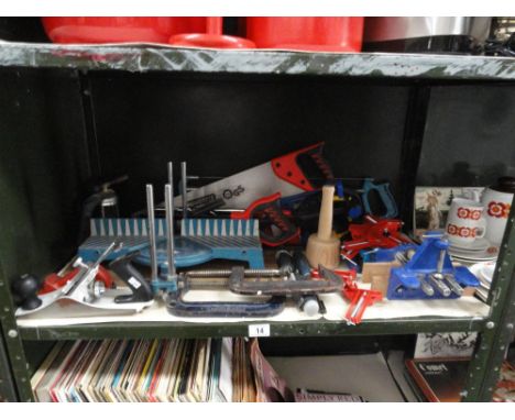 A quantity of woodworking hand tools including saws, chisels, clamps etc