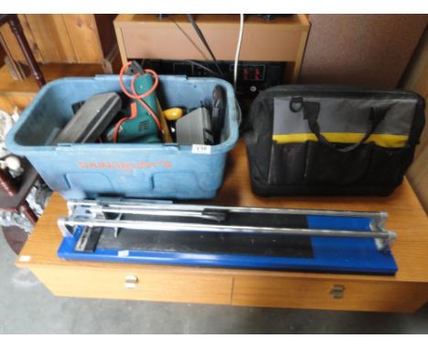 A box and a bag of hand tools including socket sets, power drill, spirit level, till cutter etc