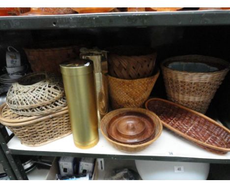 A shelf of basketware and treen