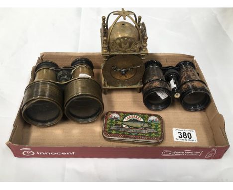 A small brass lantern clock and two pairs of vintage binoculars etc