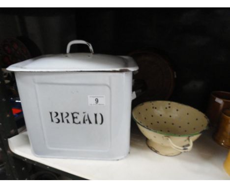 An enamel bread bin, colander, wooden bowl etc
