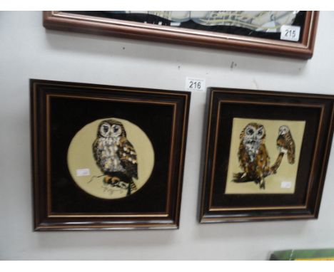 Two framed ceramic tiles featuring owls