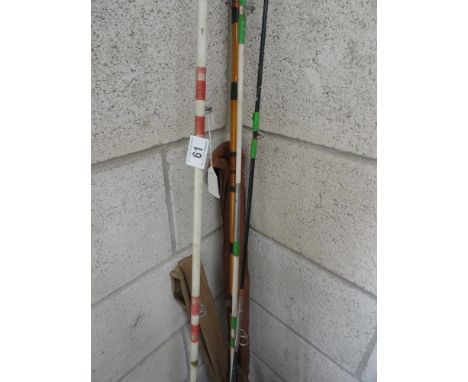 A collection of fishing rods including vintage