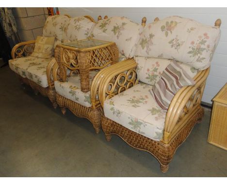 A conservatory suite consisting of 2 seater sofa, two armchairs and a table