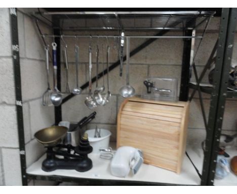 A quantity of kitchenalia including cast iron scales