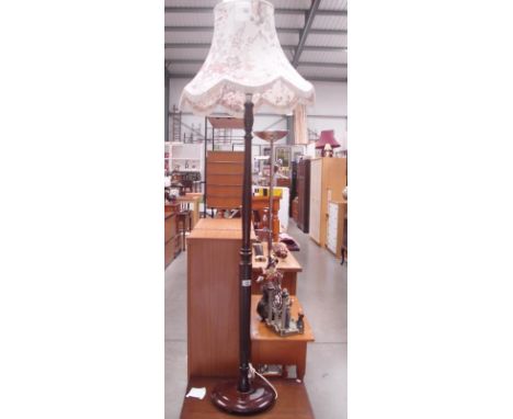 A mahogany standard lamp