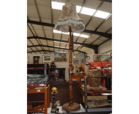 A wooden standard lamp