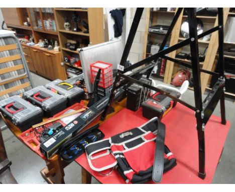 A quantity of tools and fixing including electric jigsaw, tools boxes, work bench etc