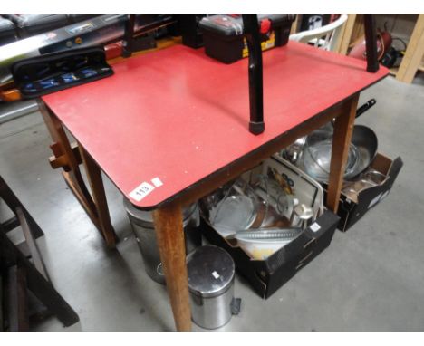 A vintage red topped kitchen table