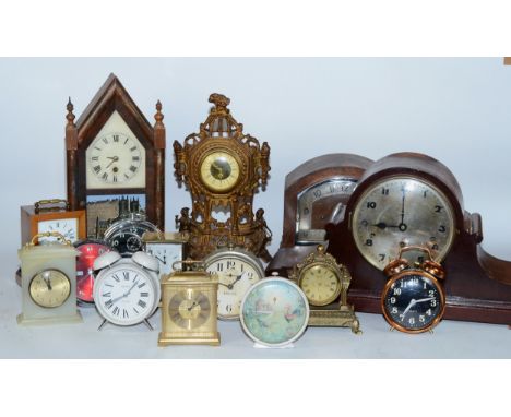 A collection of early 20th century and later clocks, to include mantel, carriage, traveling alarm and others, having manual w