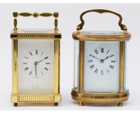 A 20th century English 8 day carriage clock, the brass case with enamelled dial, together with a unnamed example. (2) 
