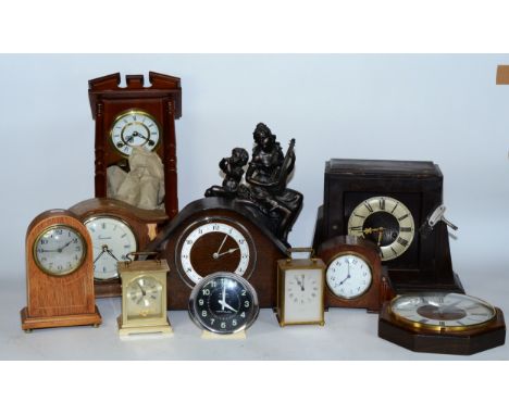 A collection of early 20th century and later clocks, to include mantel, carriage, traveling alarm and others, having manual w