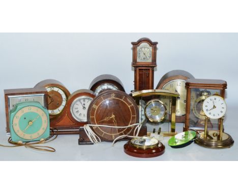 A collection of early 20th century and later clocks, to include mantel, carriage, traveling and other examples, having manual