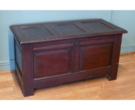 A late 17th century and later oak three panel coffer, raised on stile supports 114 x 54 x 60cm. 