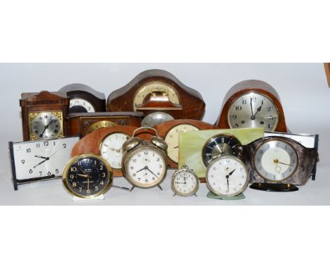 A collection of early 20th century and later clocks, to include mantel, carriage, traveling alarm and others, having manual w