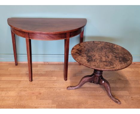 An Edwardian mahogany demilune hall table, together with an oak tripod side table, 68cm diameter. (2) 