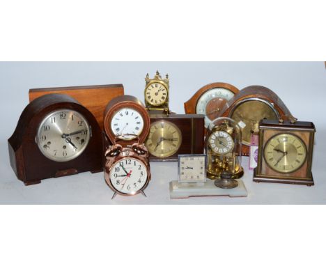 A collection of early 20th century and later clocks, to include mantel, carriage, traveling alarm and others, having manual w
