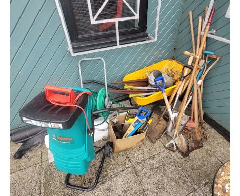 A Bosch Rapid electric garden shredder, AXT2200, together with a quantity of garden hand tools, hose and wheelbarrow. 