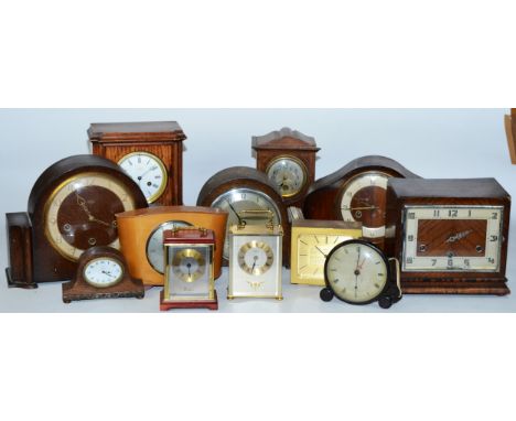 A collection of early 20th century and later clocks, to include mantel, carriage, traveling and others, having manual wind an